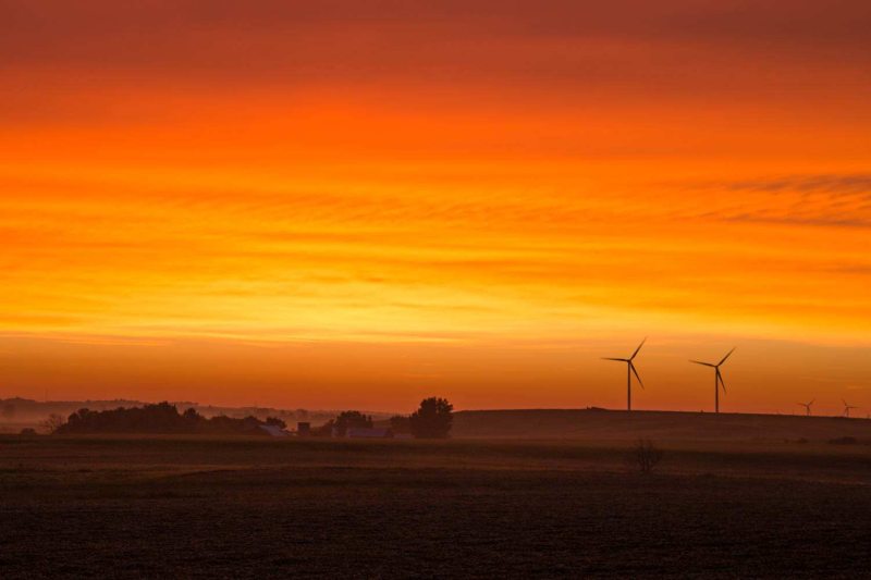 Beautiful orange sunrise with wind turbines, southwestern Minnesota.