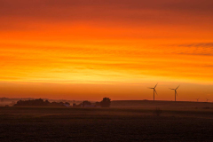 Beautiful orange sunrise with wind turbines, southwestern Minnesota.